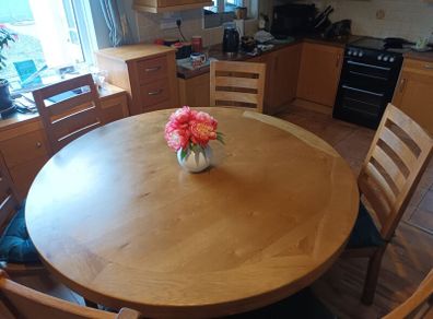 Large round oak table with 4 chairs