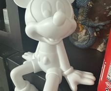 White Mickey Mouse seating ornament.