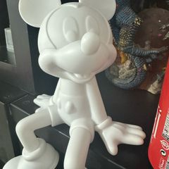 White Mickey Mouse seating ornament.