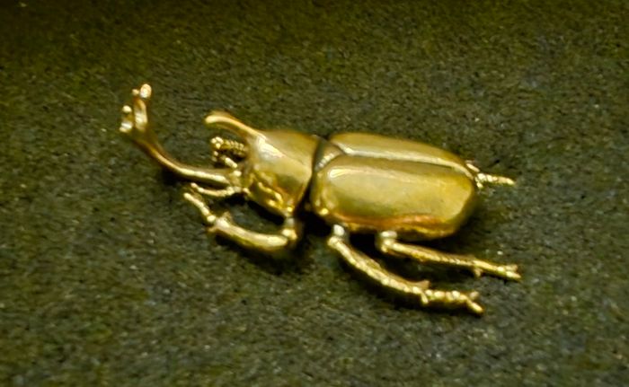 3 brass beetles.