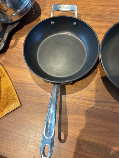 Set of All Clad pots and pans