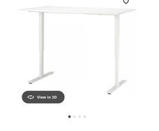 Desk height-adjustable with Desktop drawers.