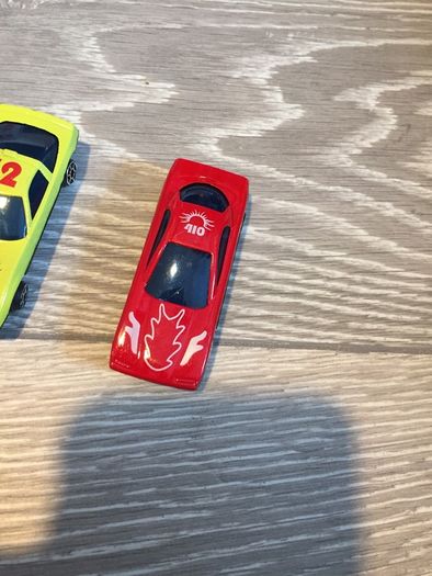 Four plastic Toy Cars