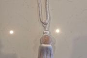 Curtain tie back.