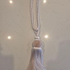 Curtain tie back.