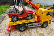 Bruder MAN TGA Tow Truck with All-Terrain Jeep