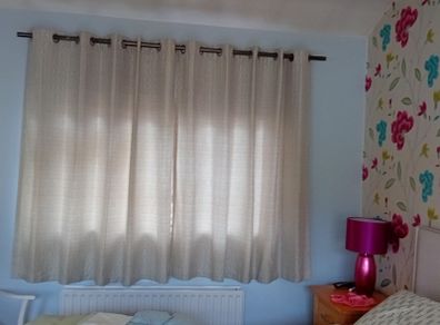 Eye let Curtains grey/beige in perfect condition 64"wide 61" long.