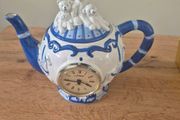 Blue and white ceramic teapot with quartz clock