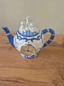 Blue and white ceramic teapot with quartz clock