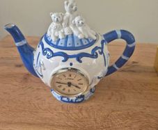 Blue and white ceramic teapot with quartz clock