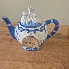 Blue and white ceramic teapot with quartz clock