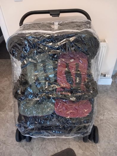 Joie double baby's buggie with rain covers