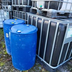 IBC tanks and blue barrels