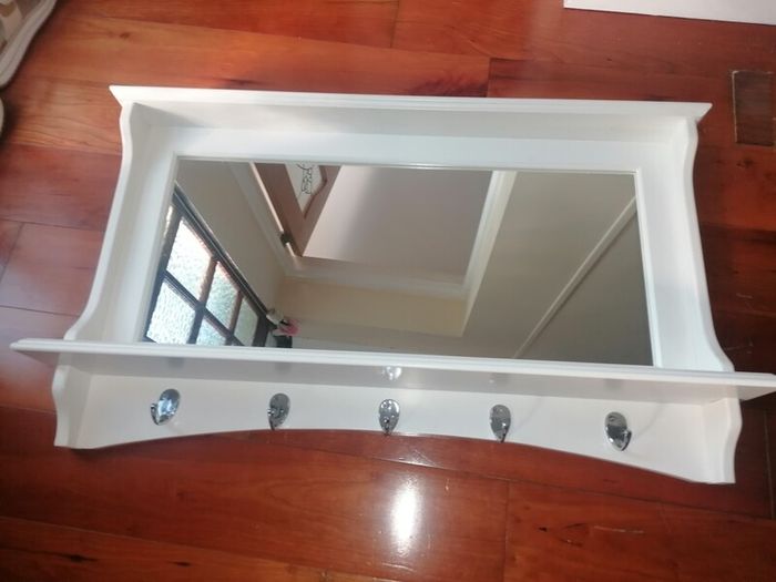 Beautiful wooden framed hall mirror, with coat & hat hooks.