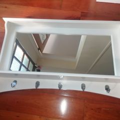 Beautiful wooden framed hall mirror, with coat & hat hooks.