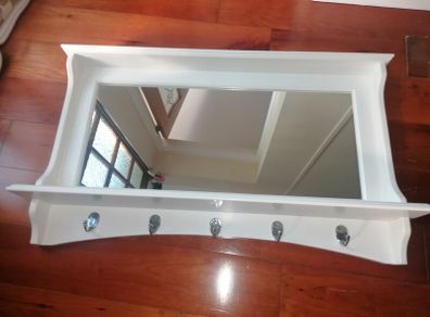 Beautiful wooden framed hall mirror, with coat & hat hooks.