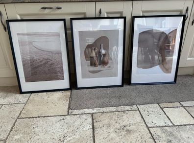 large black frames and prints x3