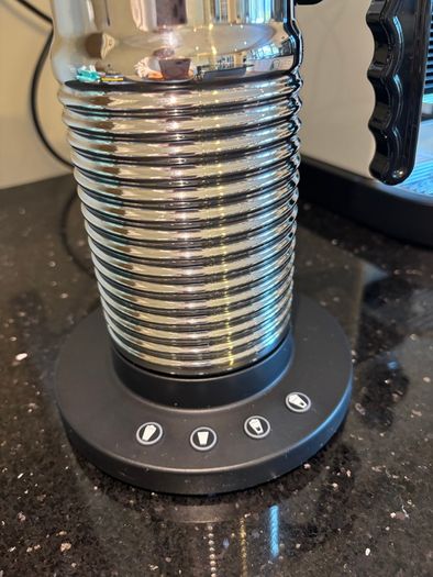 Nespresso espresso machine, milk frother and cups