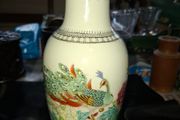 Chinese porcelain vase from the Jingdezhen region featuring a hand painted peacock and floral motif., Postage Available