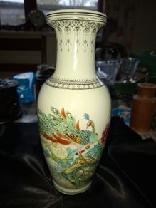 Chinese porcelain vase from the Jingdezhen region featuring a hand painted peacock and floral motif., Postage Available