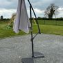 Large parasol and two weights. Bought for 170 last summer. Selling due to getting a pergola installed Image 2