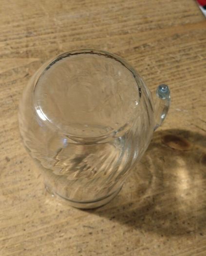 Luminarc glass pitcher with a ribbed design.