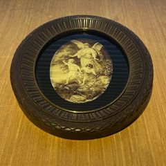 Vintage wall hanging depicting a scene of a guardian angel watching over 2 children