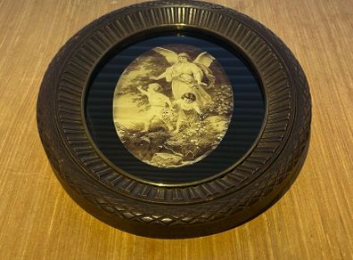 Vintage wall hanging depicting a scene of a guardian angel watching over 2 children