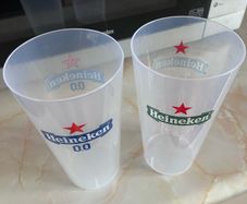 2 plastic Heineken glasses