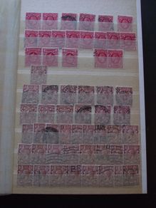 A huge collection of used George V stamps in the stock book.