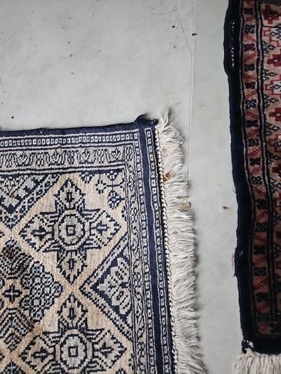 tiny wool rug...small mark on fringe.