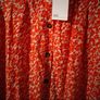 Asos Printed Crepe Midi Skirt features an orange ditsy floral print and a button down front. New with Tags Image 3