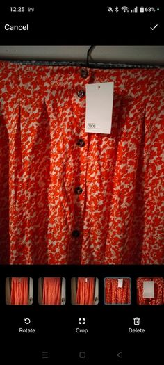 Asos Printed Crepe Midi Skirt features an orange ditsy floral print and a button down front. New with Tags