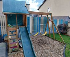 playhouse with swing and slide