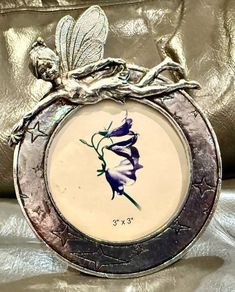 The Enameled Metal Fairy Round Photo Picture Frame.