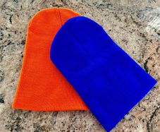 Pair of orange and blue hats