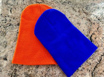 Pair of orange and blue hats