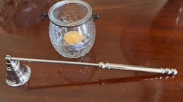 Metal Handle Candle Snuffer. Silver Finish. Moveable Head. With Hanging Tea Light. In Excellent Condition.