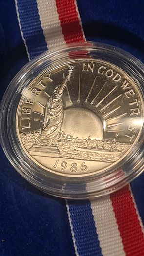American 1986s silver dollar. Ellis Island