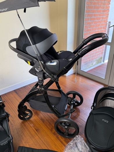 As New Egg2 travel system with Cybex car seat and isofix base swivel