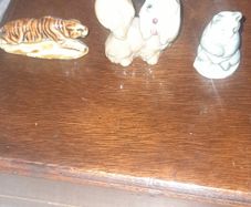 Solid Porcelain Miniature Figurines of Tiger, Poodle and a Seated Panda, possibly from Japan, in good condition, postage available or collection