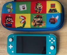Nintendo Switch Lite with Pokemon Sword & Lego Mario Case