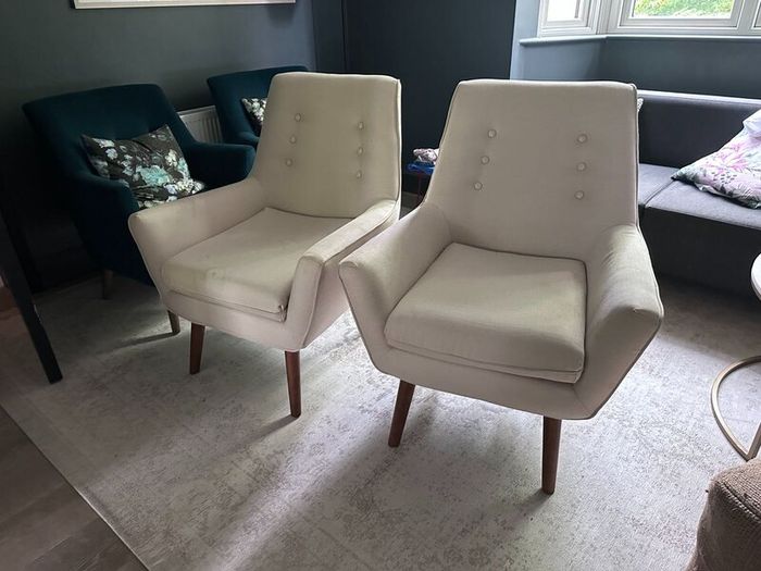 Two creme stylish armchairs