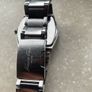 Kenneth Cole designer watch. Water Resistant. A few worn scratches but still working perfectly. Battery easily replaced and sits into the back of it. Image 7