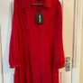 Brand new dress . Still with tag but with stained on left sleeve. Image 2