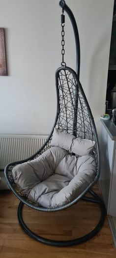 egg chair, original outdoor grey cushion. Including extra cushions & throw. Used indoors. Will include large and small cushion and fake throw