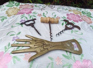 A Trio of Victorian Cork Screws and Brass Hand Bottle Opener