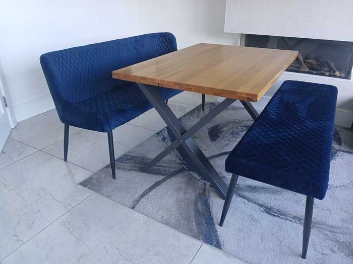 Dining table with two blue velvet benches
