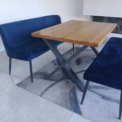 Dining table with two blue velvet benches