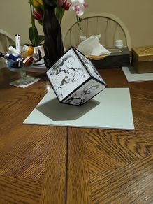 Photo cube revolving